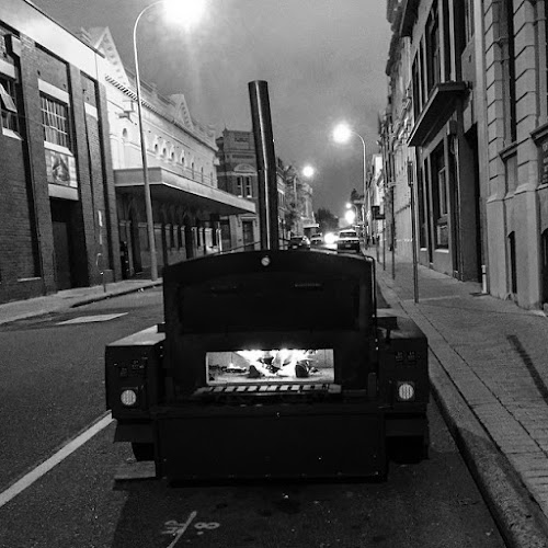 8 slice productions wood fired pizza caterting